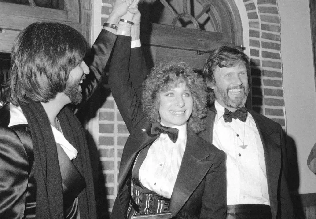 Producer Jon Peters, from left, Barbra Streisand and Kris Kristofferson appear at a preview of the film, "A Star is Born," in Dec. 23, 1976, in New York. Suzanne Vlamis/AP